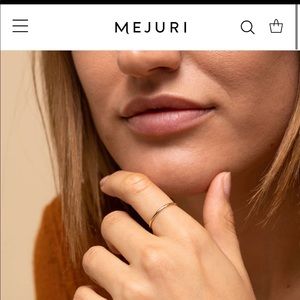 14k gold Mejuri Stacker ring.